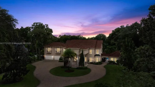 a view of a patio with a dining table and chairs with wooden floor and fence