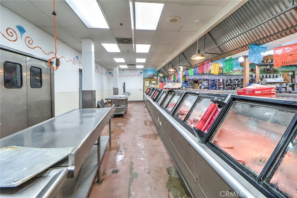12242 Valley Boulevard El Monte, CA 91732 - Photo 19 of 32 a kitchen with stainless steel appliances granite countertop lots of counter space and sink