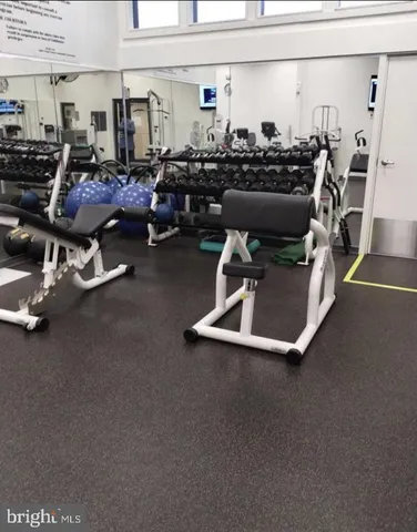 a view of gallery with glass door and balcony