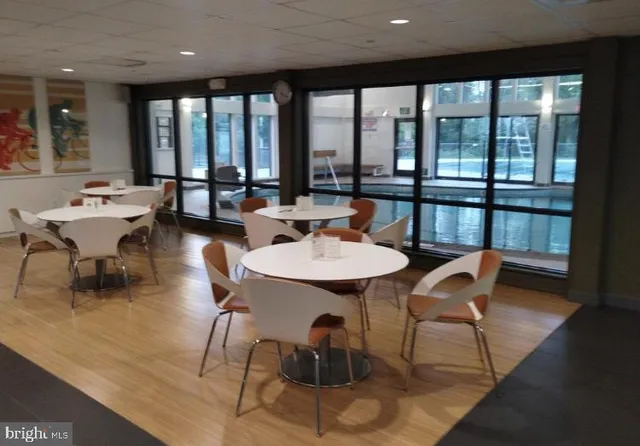a kitchen with kitchen island granite countertop a sink and wooden cabinets
