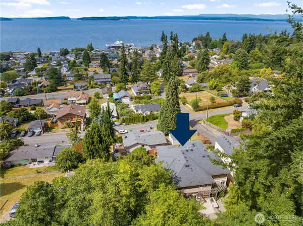 an aerial view of a house with a yard