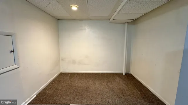 an empty room with a bench