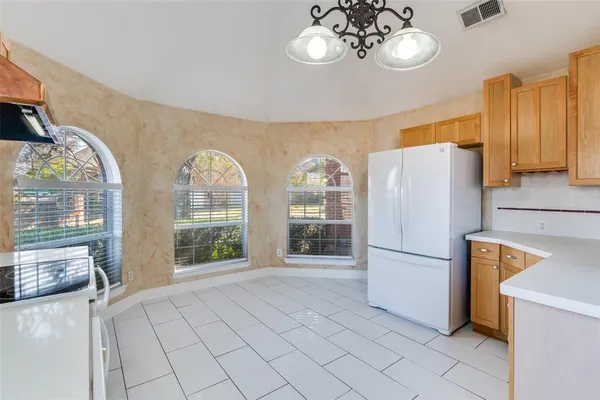 a kitchen with stainless steel appliances a stove a sink and a refrigerator