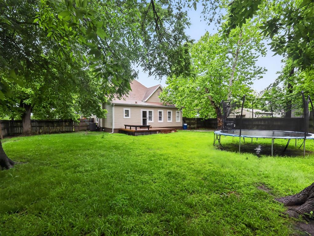 1301 Locust Street Commerce, TX 75428 - Photo 16 of 17 a view of a house with backyard and garden