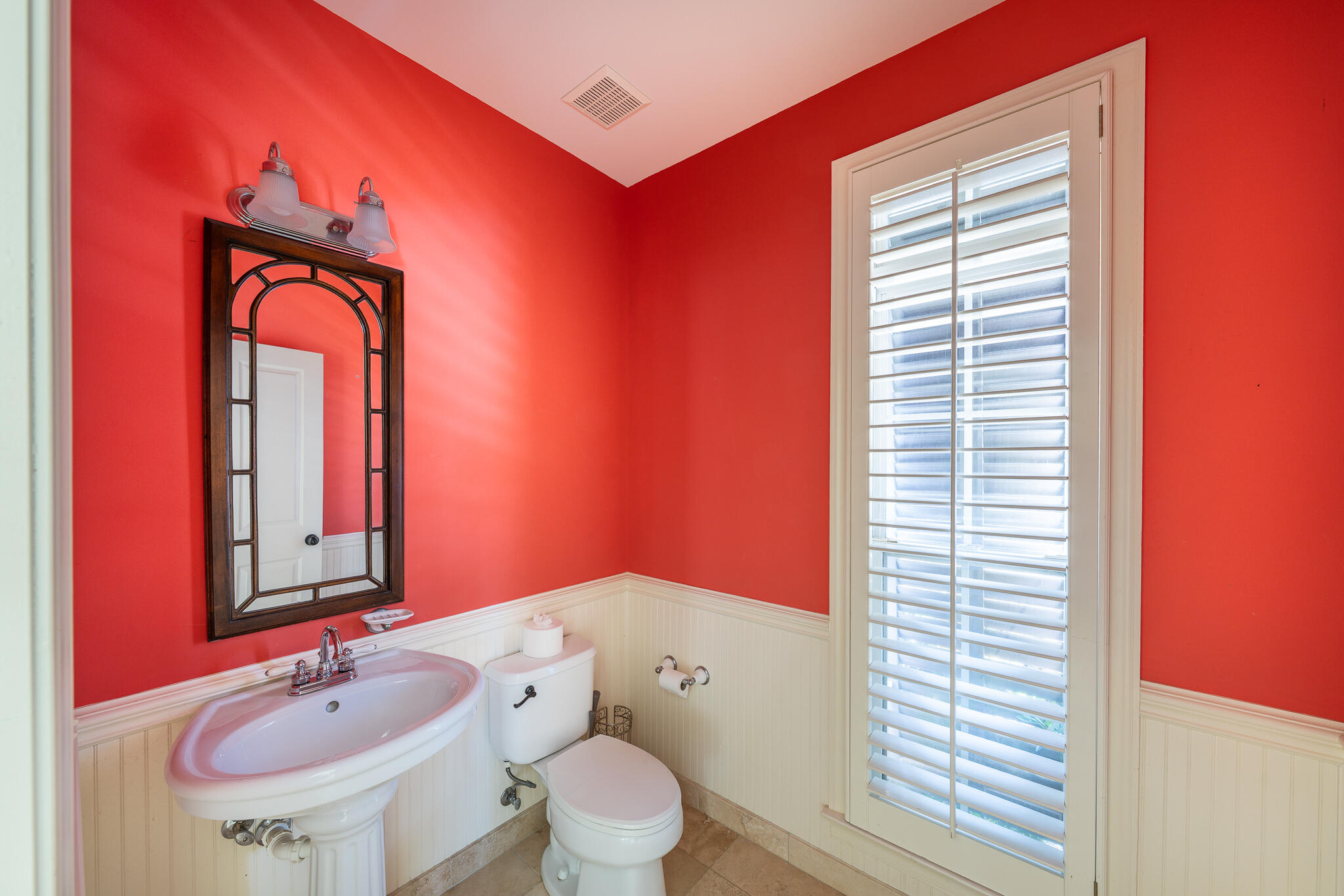 106 Tuscany Drive Destin, FL 32541 - Photo 11 of 41 a bathroom with a toilet sink and mirror