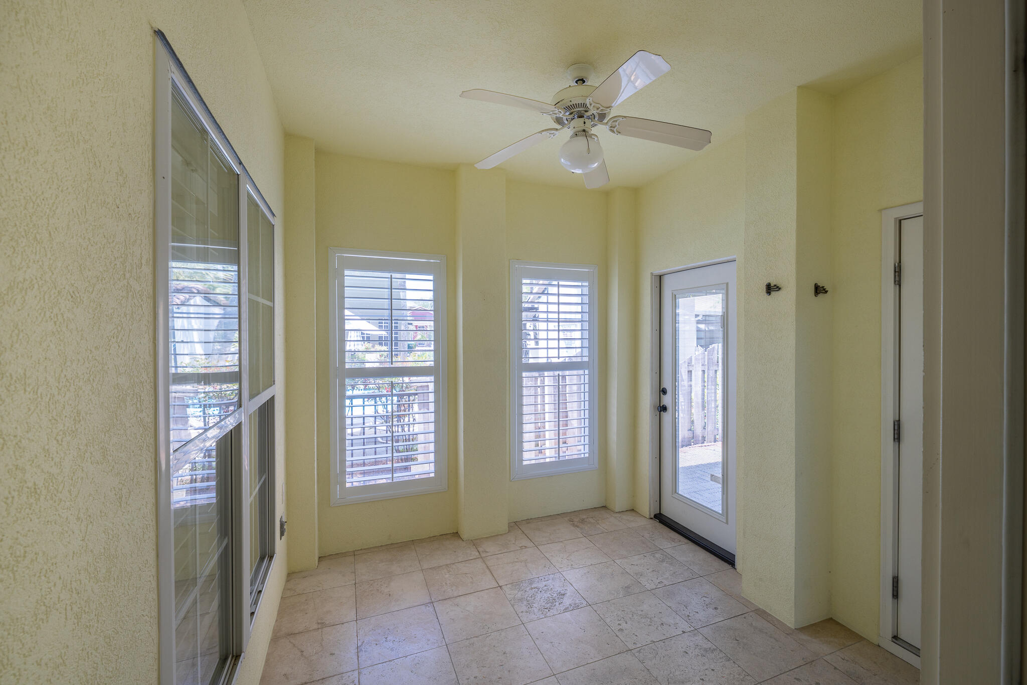 106 Tuscany Drive Destin, FL 32541 - Photo 14 of 41 wooden floor in an empty room with a window