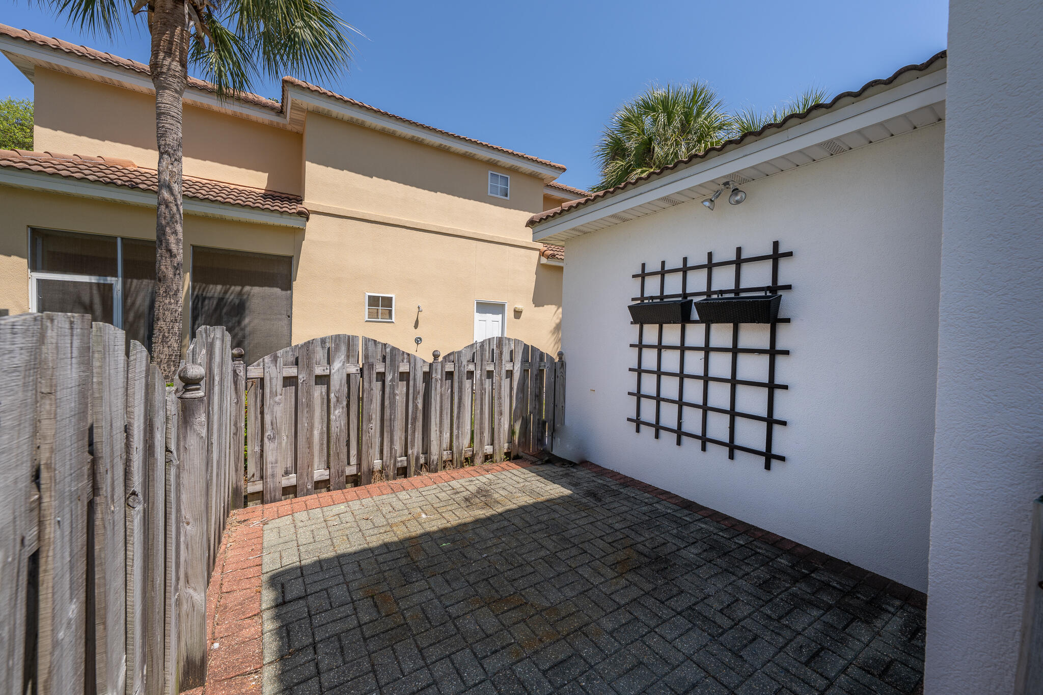 106 Tuscany Drive Destin, FL 32541 - Photo 15 of 41 a view of a house with a window and wooden fence