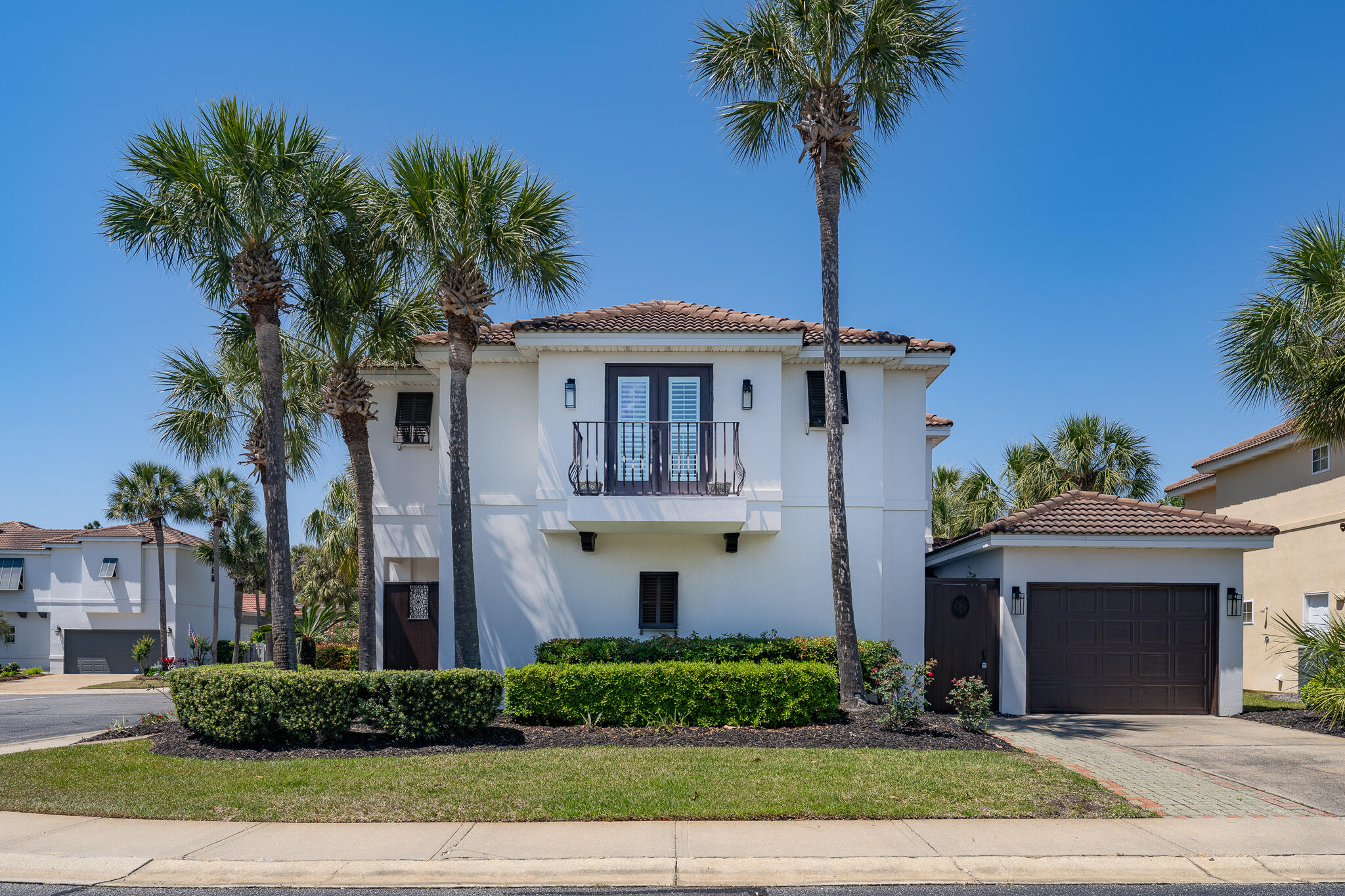 106 Tuscany Drive Destin, FL 32541 - Photo 2 of 41 a front view of a house with garden