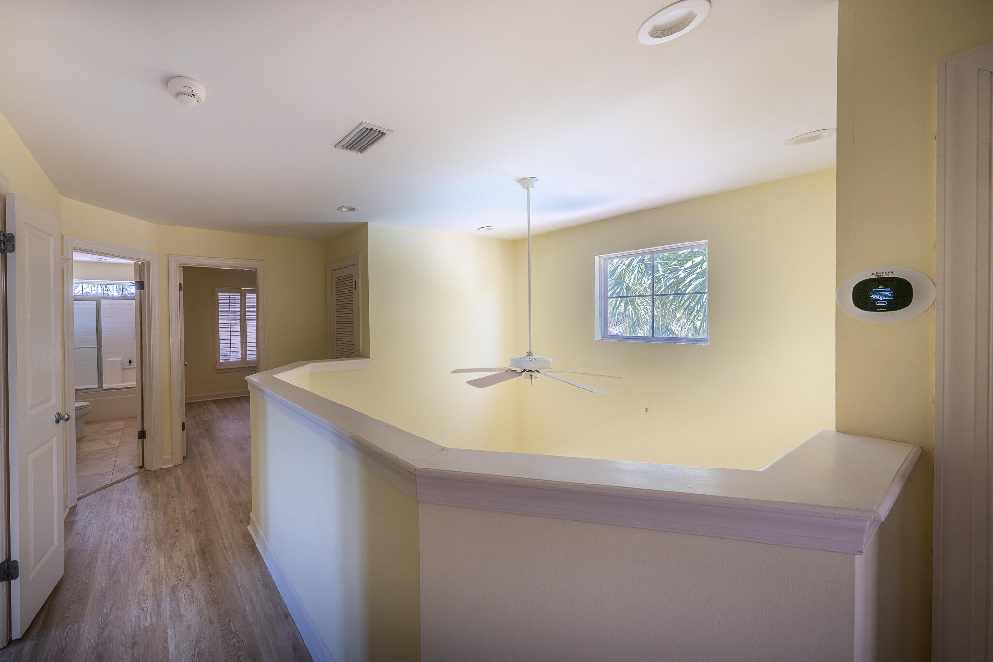 106 Tuscany Drive Destin, FL 32541 - Photo 21 of 41 a room with a table and wooden floor