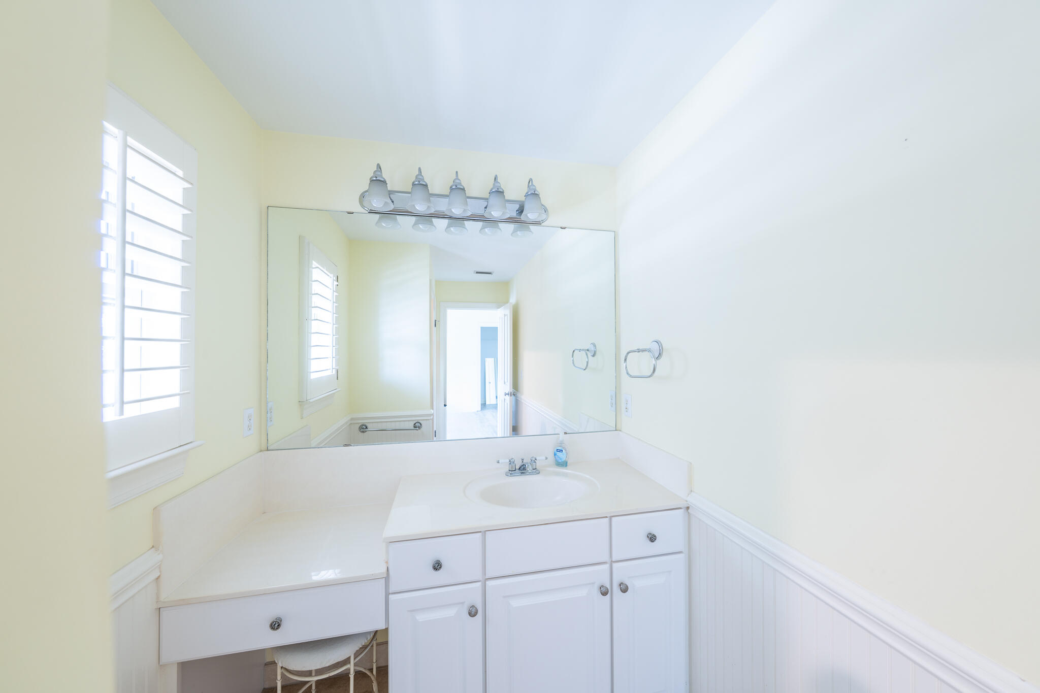 106 Tuscany Drive Destin, FL 32541 - Photo 24 of 41 a bathroom with a sink and a mirror