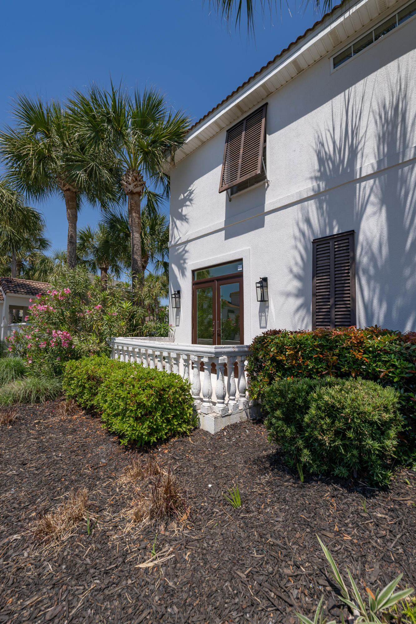 106 Tuscany Drive Destin, FL 32541 - Photo 29 of 41 a front view of a house with garden