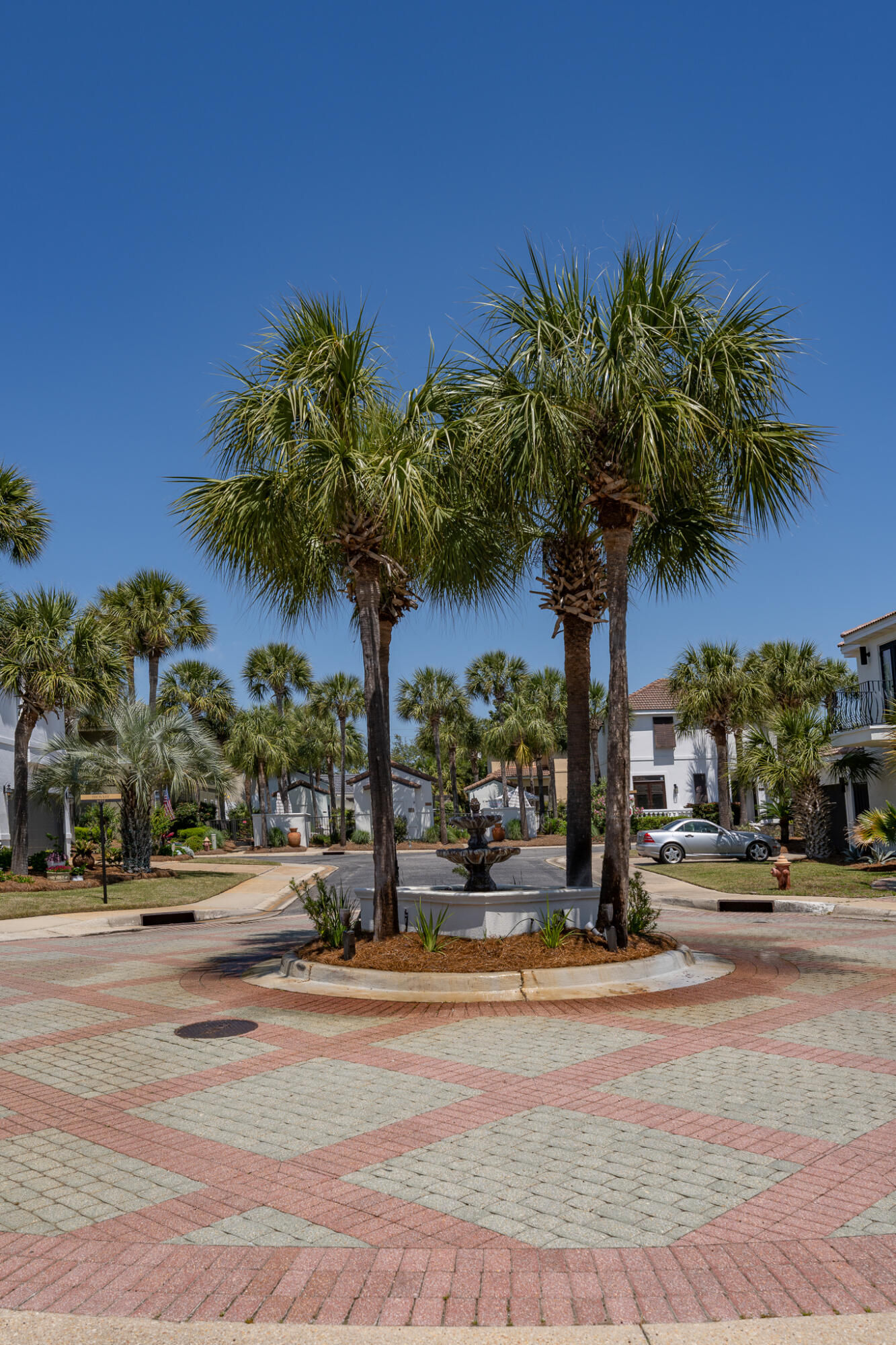 106 Tuscany Drive Destin, FL 32541 - Photo 30 of 41 a view of a road with a building in the background