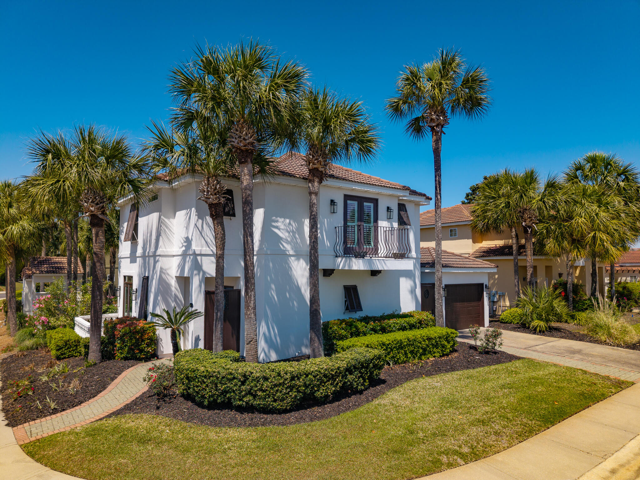 106 Tuscany Drive Destin, FL 32541 - Photo 39 of 41 a front view of a house with a yard and palm tree