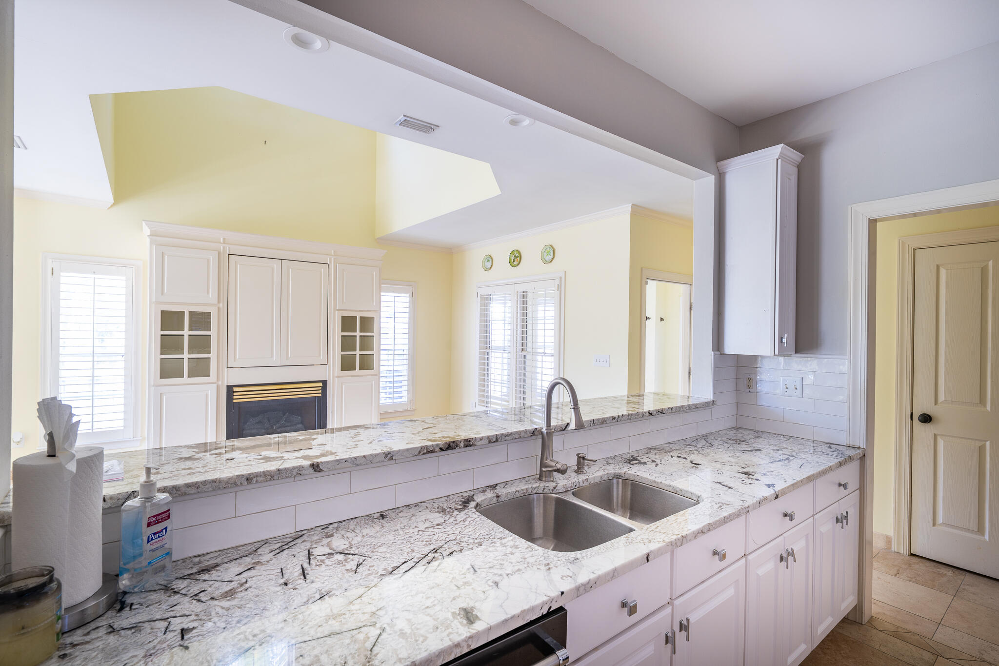 106 Tuscany Drive Destin, FL 32541 - Photo 6 of 41 a kitchen with granite countertop a sink and a refrigerator