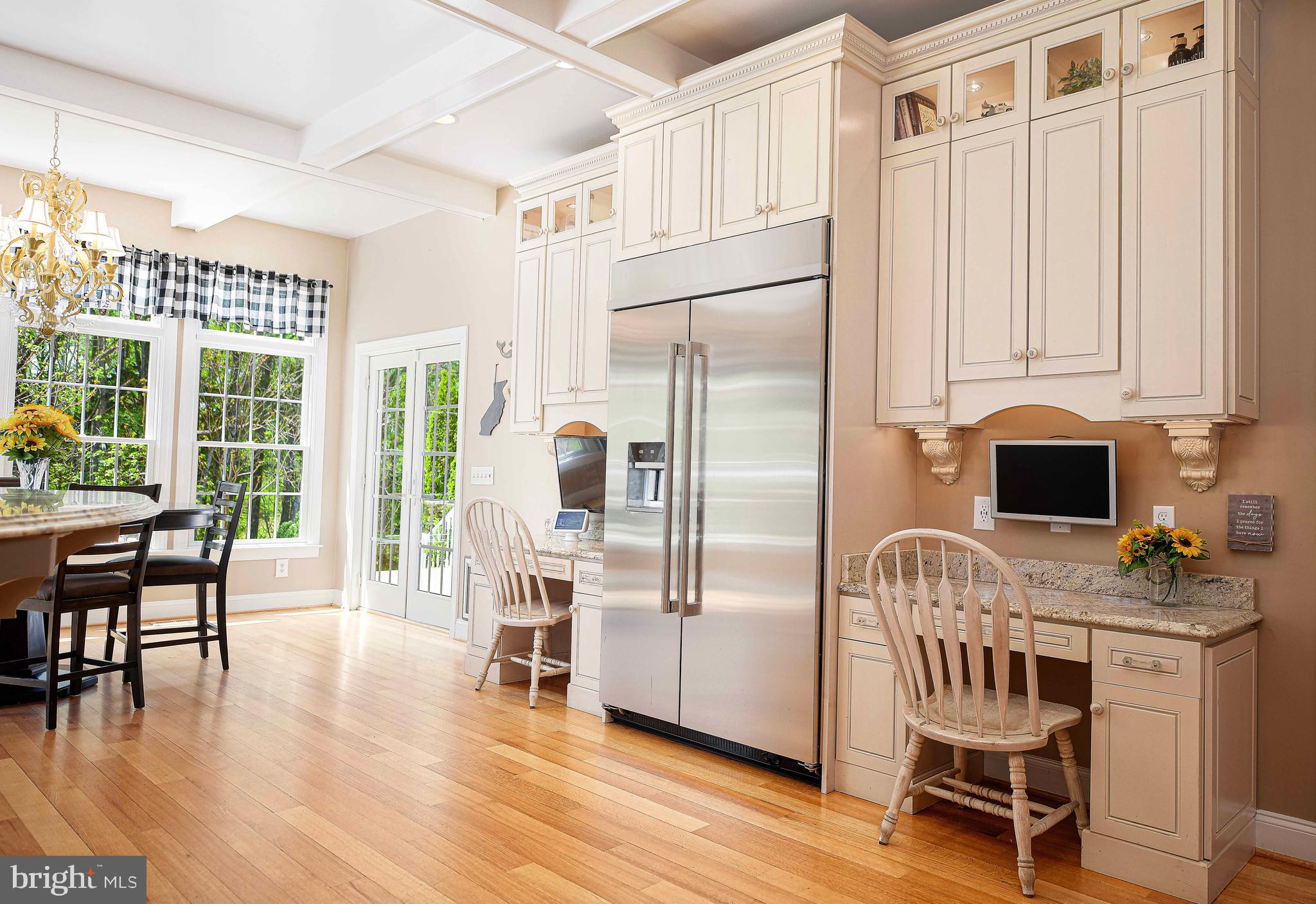2874 Ady Road Forest Hill, MD 21050 - Photo 26 of 85 a kitchen with granite countertop a refrigerator a stove a dining table and chairs