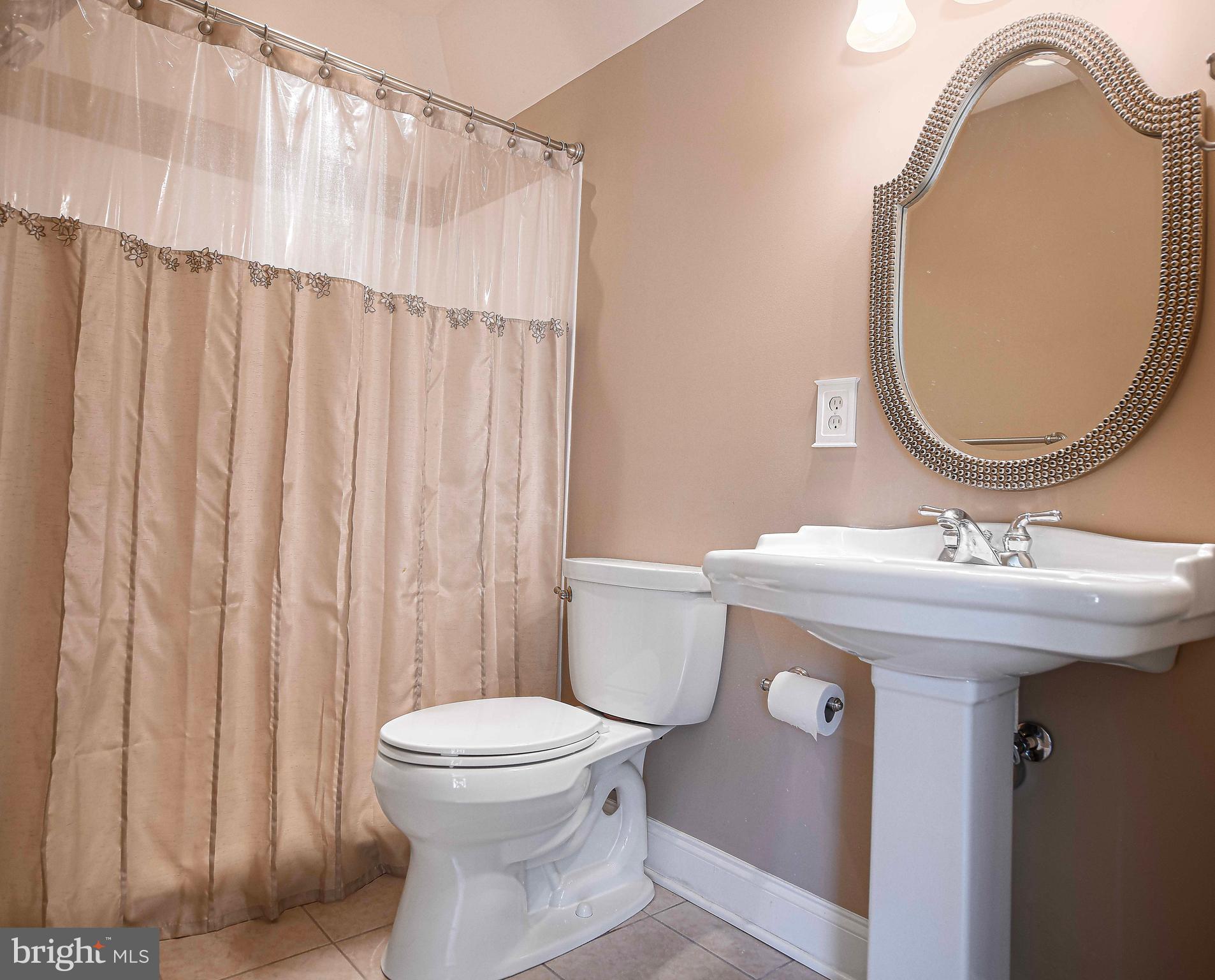 2874 Ady Road Forest Hill, MD 21050 - Photo 51 of 85 a bathroom with a sink a toilet and a mirror
