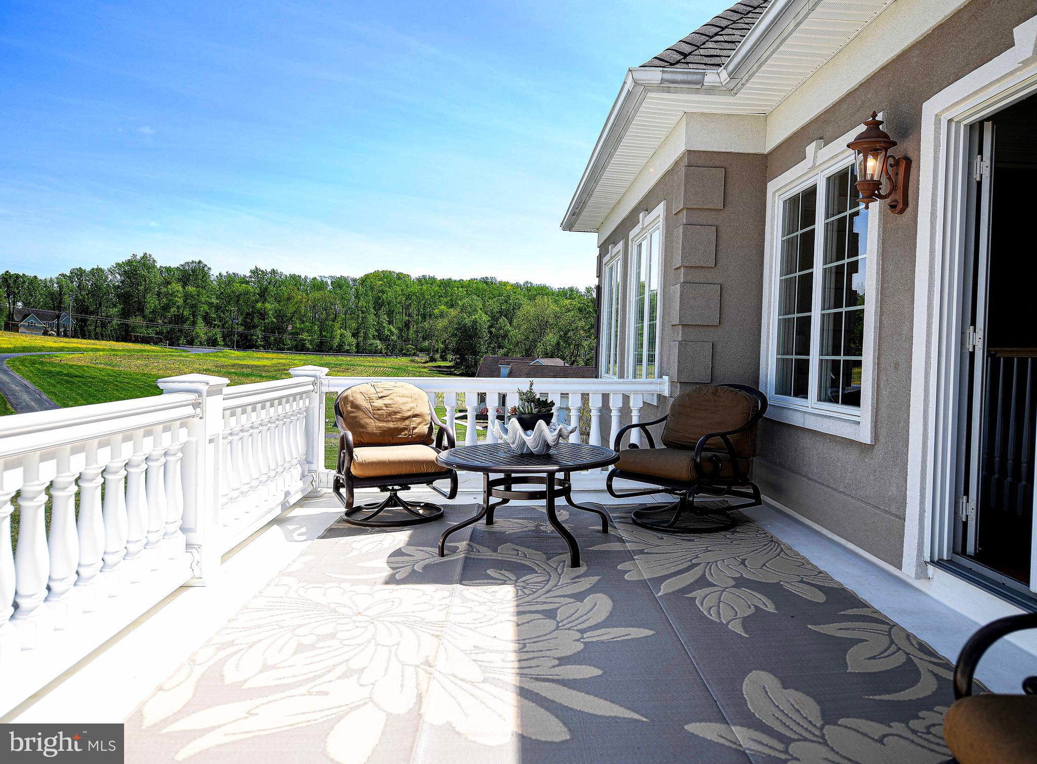 2874 Ady Road Forest Hill, MD 21050 - Photo 9 of 85 a roof deck with table and chairs and couches with wooden floor and fence