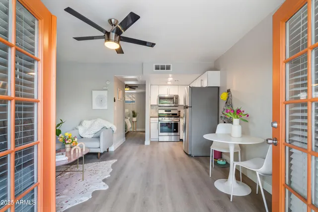 a living room with furniture and a table