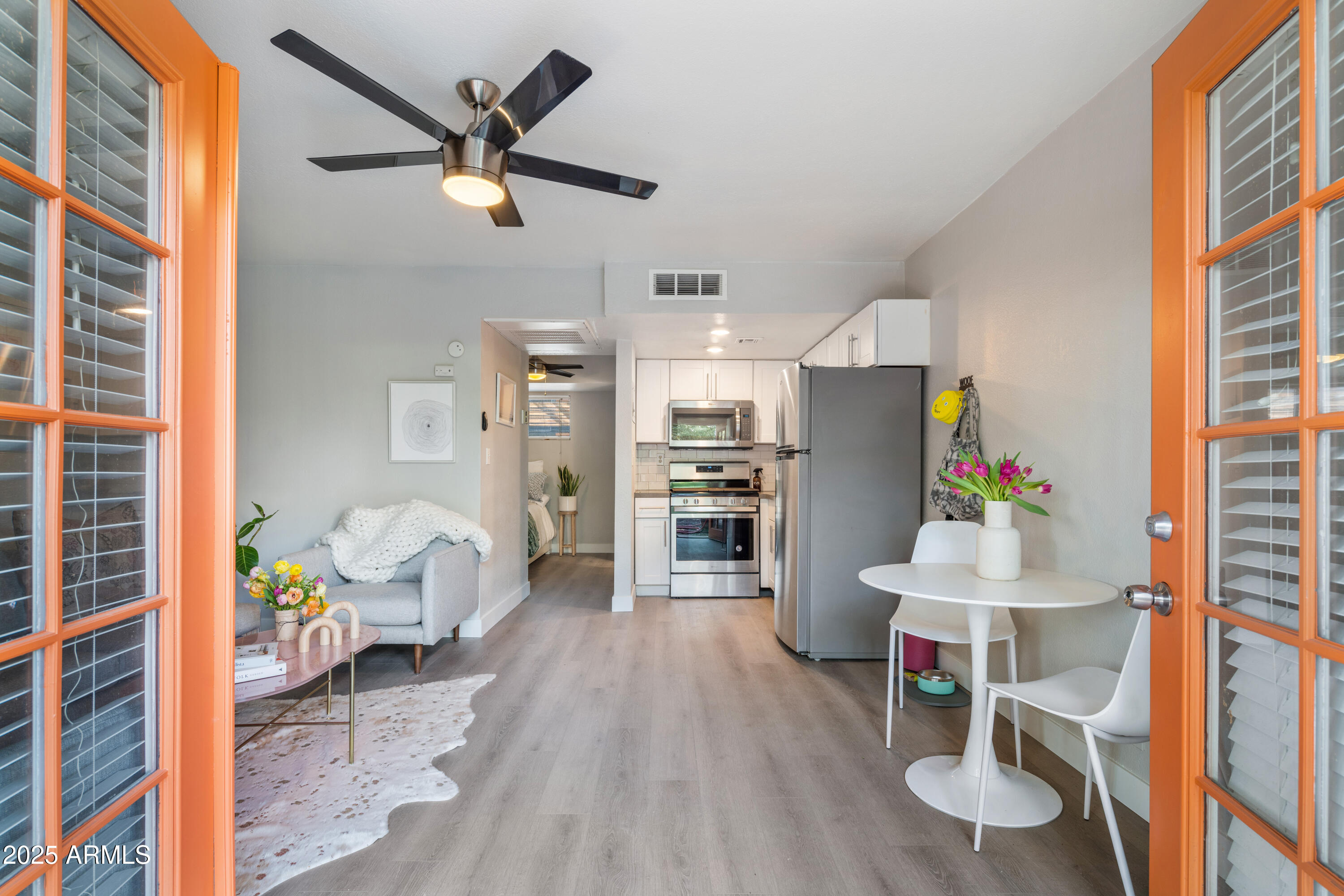 a living room with furniture and a table