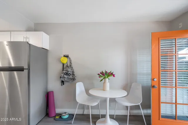 a dining room with furniture and window