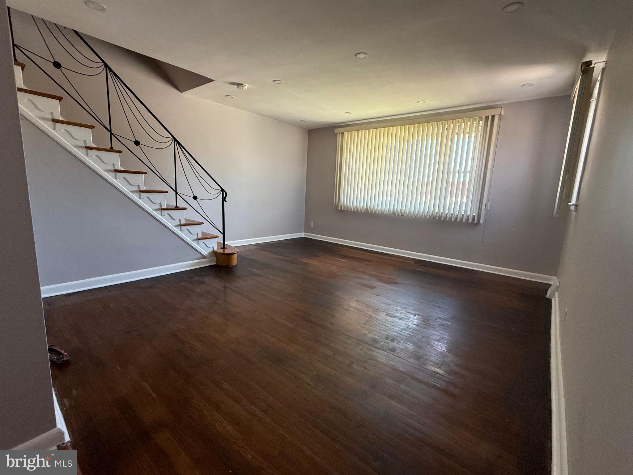 9083 Convent Avenue Philadelphia, PA 19136 - Photo 10 of 22 a view of an empty room with wooden floor and a window