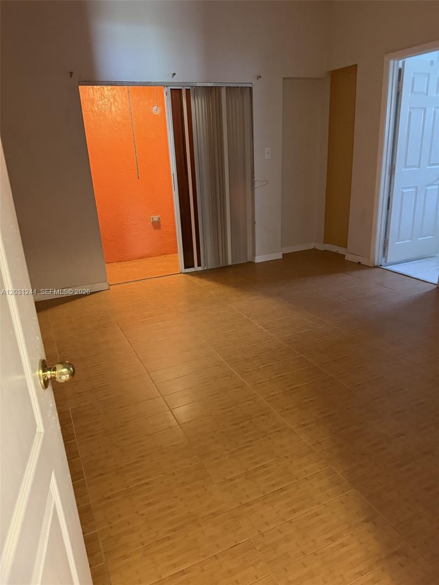 13752 Southwest 156th Street Miami, FL 33177 - Photo 8 of 14 a view of an empty room with a window