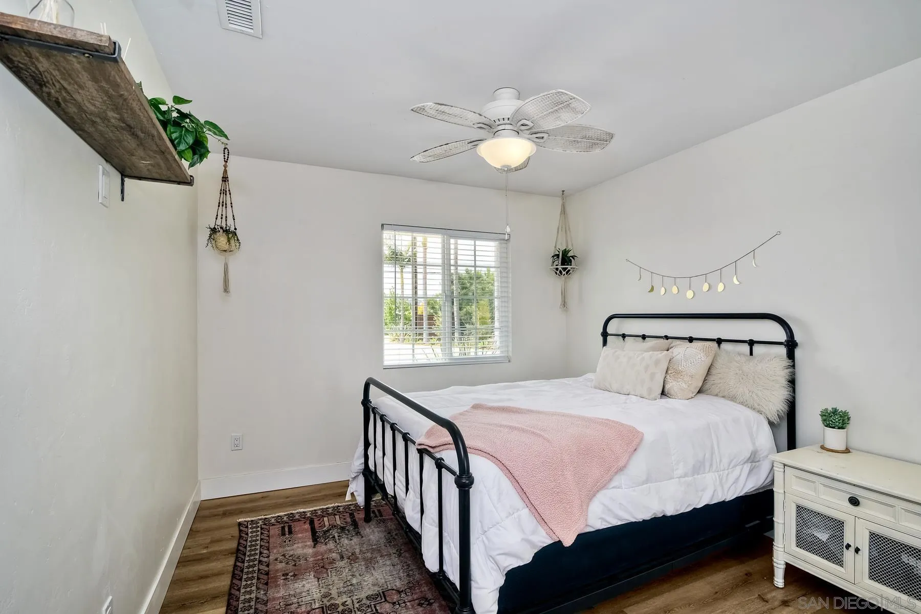 1451 Ridge Road Vista, CA 92081 - Photo 13 of 31 a bedroom with a bed and a window