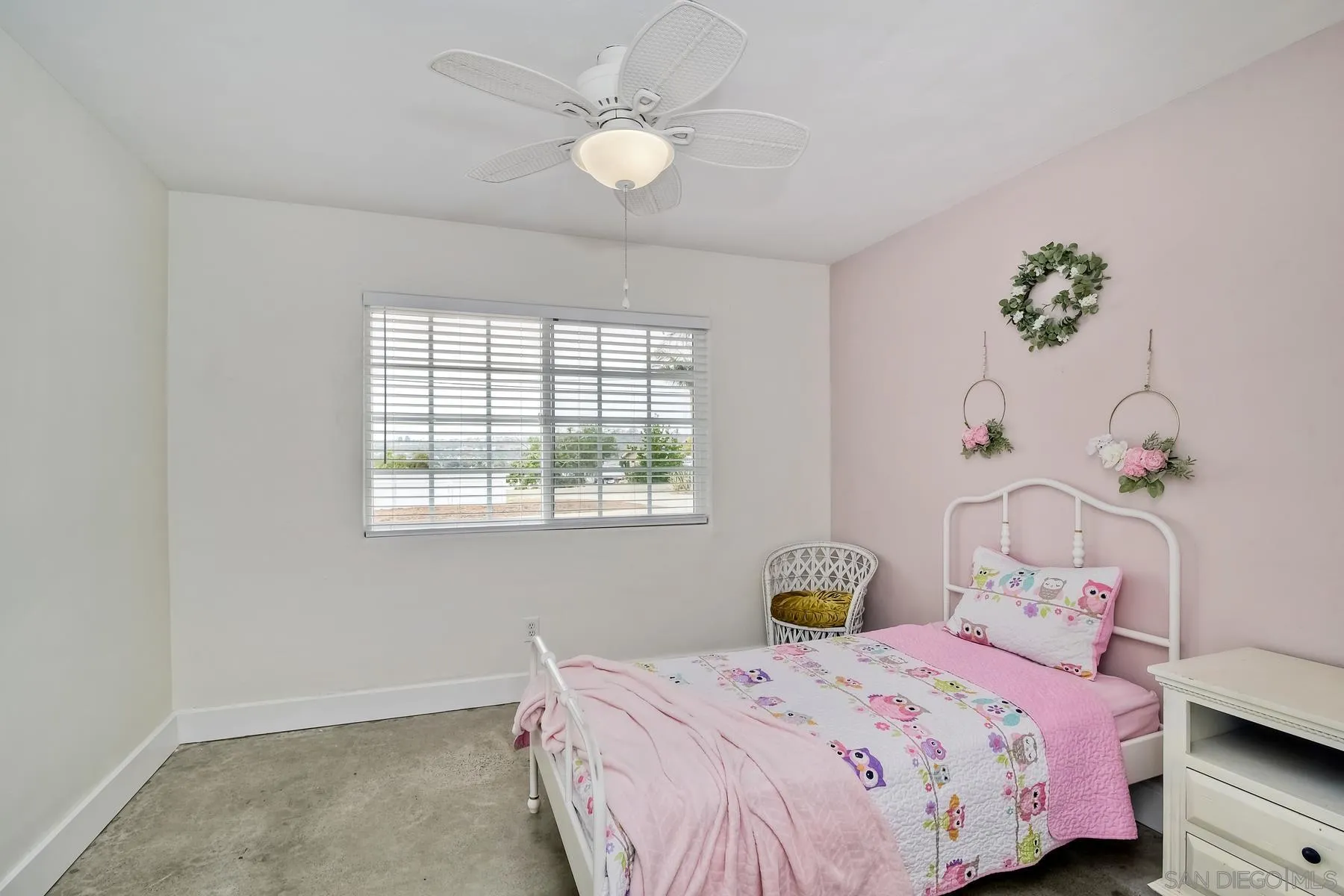 1451 Ridge Road Vista, CA 92081 - Photo 14 of 31 a bedroom with a bed and a chandelier