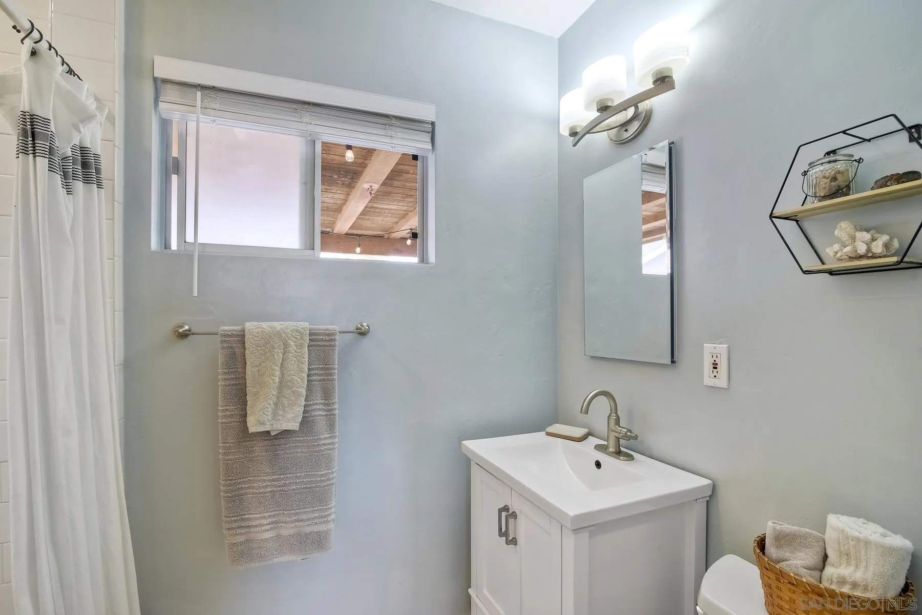 1451 Ridge Road Vista, CA 92081 - Photo 16 of 31 a bathroom with a sink mirror and toilet
