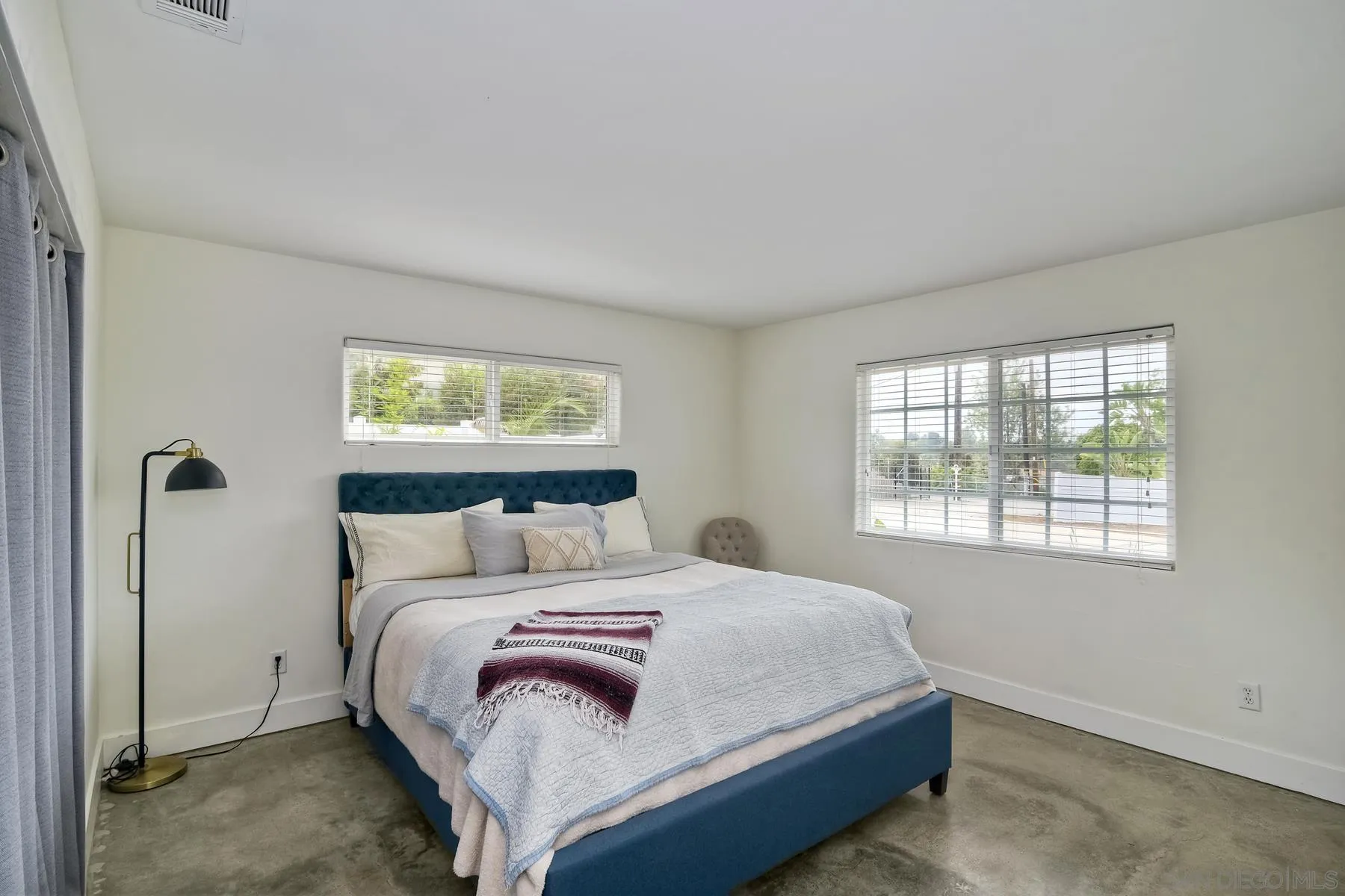 1451 Ridge Road Vista, CA 92081 - Photo 17 of 31 a bedroom with a bed and a window