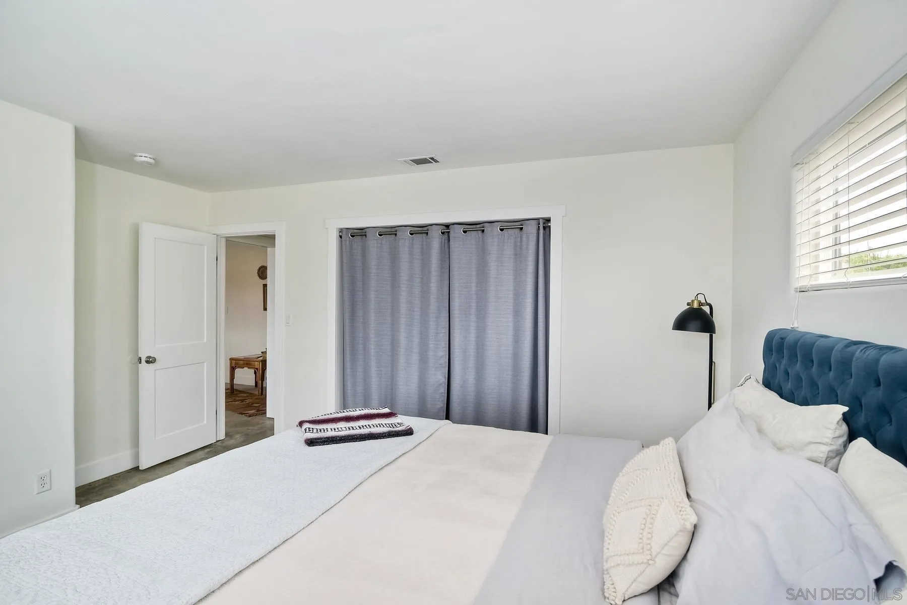 1451 Ridge Road Vista, CA 92081 - Photo 18 of 31 a bedroom with a bed and a window