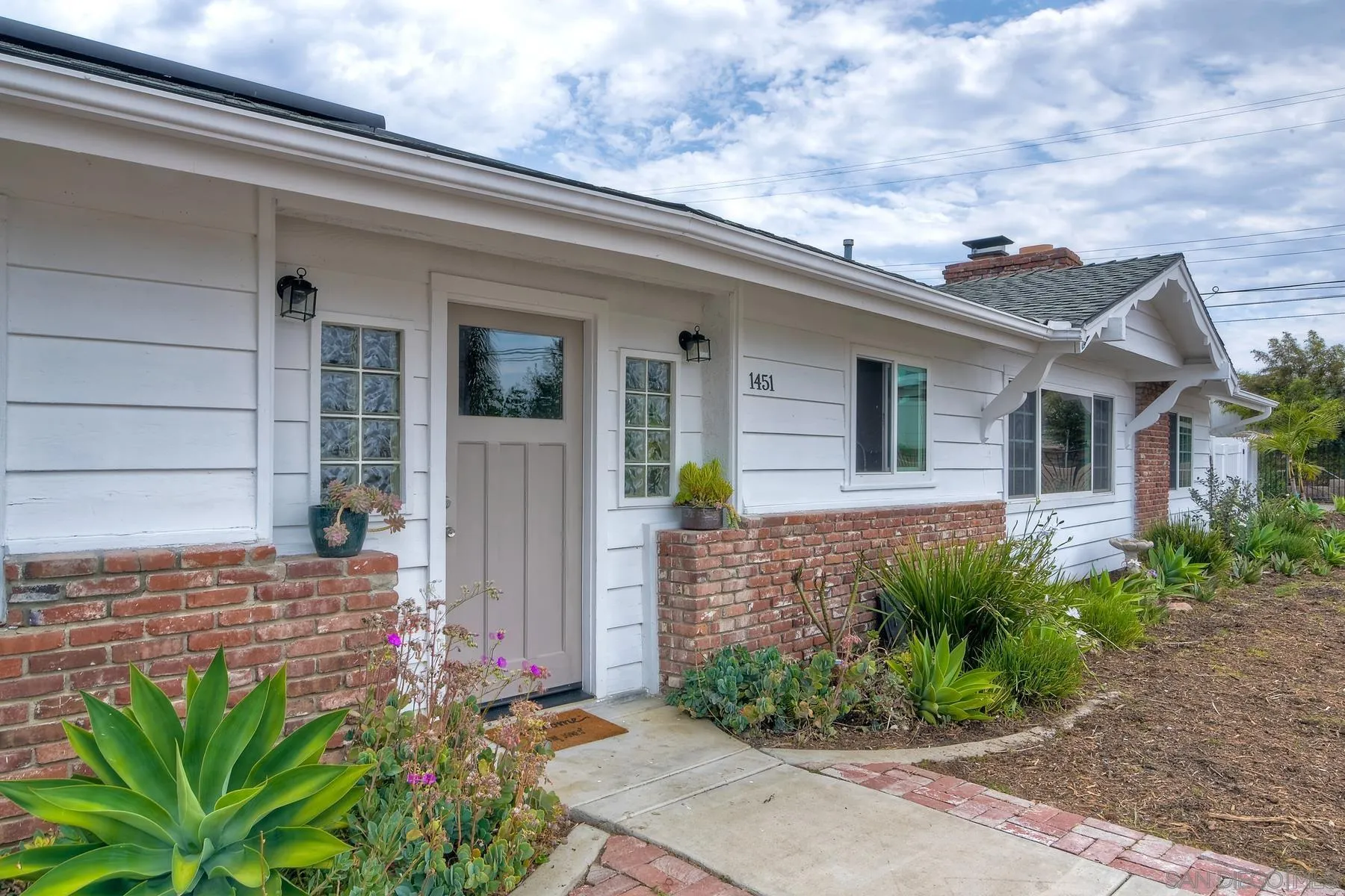 1451 Ridge Road Vista, CA 92081 - Photo 3 of 31 a front view of a house with garden