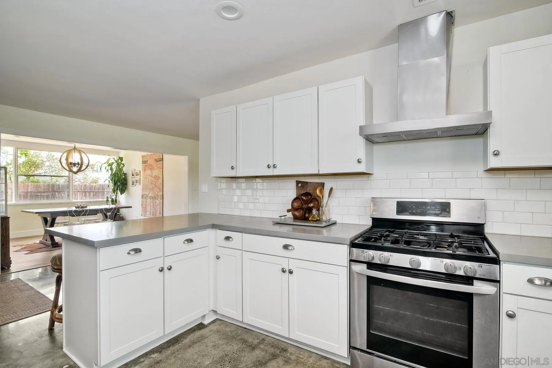 1451 Ridge Road Vista, CA 92081 - Photo 7 of 31 a kitchen with granite countertop white cabinets and white appliances