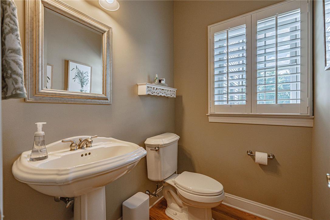 6000 Pond View Terrace Bath, PA 18014 - Photo 19 of 69 A functional half bathroom features a pedestal sink and window with plantation shutters.