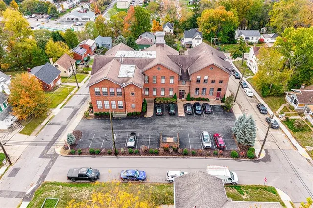 an aerial view of residential houses with outdoor space