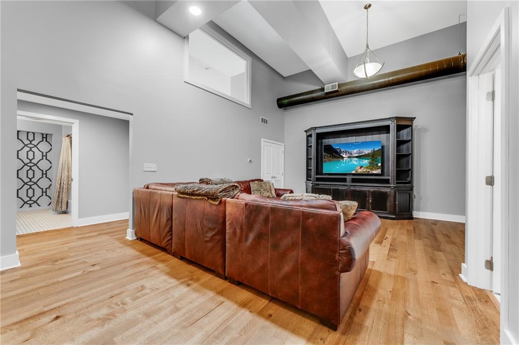 10 Walnut Street, Unit 7 Pittsburgh, PA 15202 - Photo 8 of 49 a living room with furniture and a flat screen tv