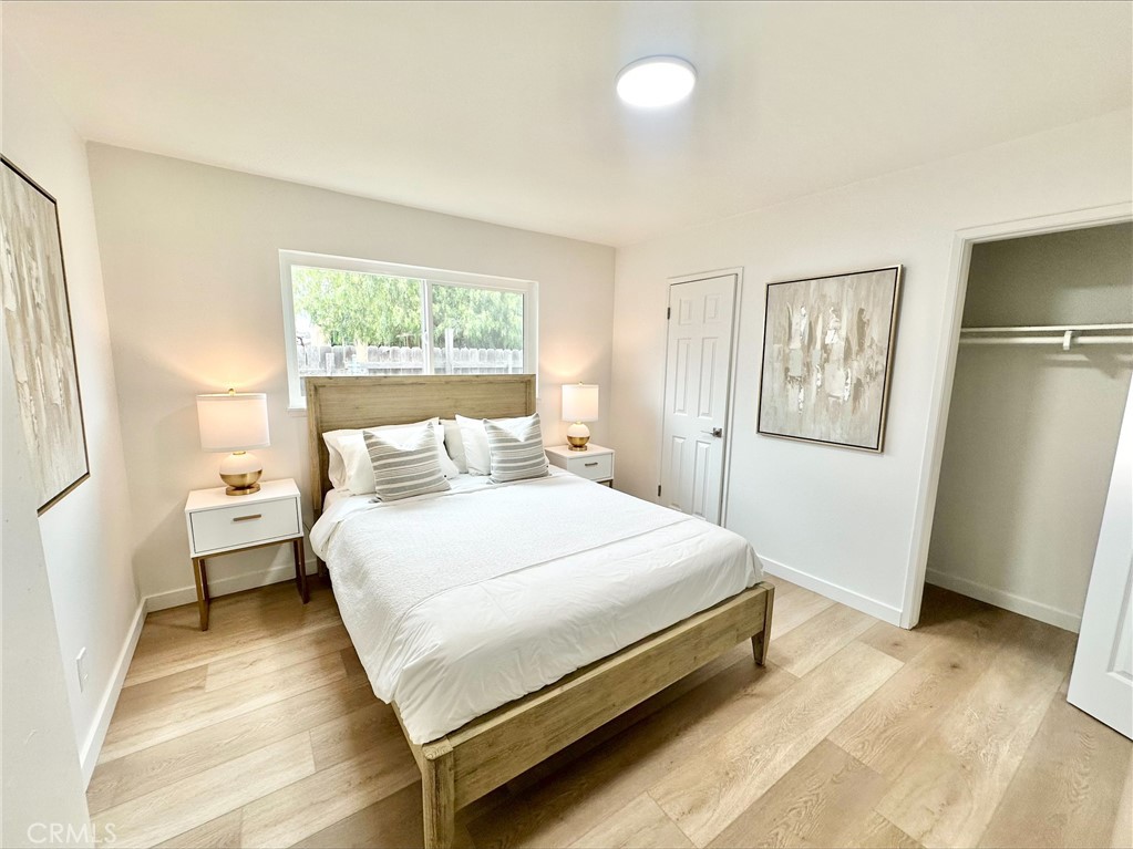 1608 Alviso Street Simi Valley, CA 93065 - Photo 11 of 13 a large bed sitting in a bedroom next to a window