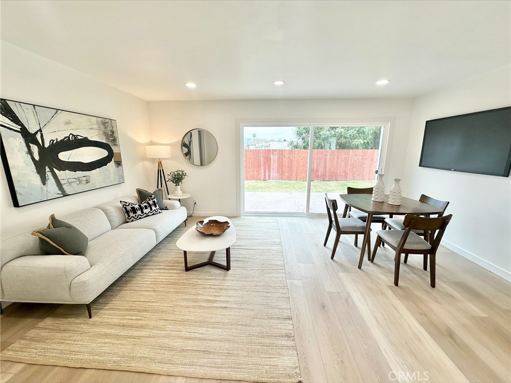 1608 Alviso Street Simi Valley, CA 93065 - Photo 8 of 13 a living room with furniture and a flat screen tv