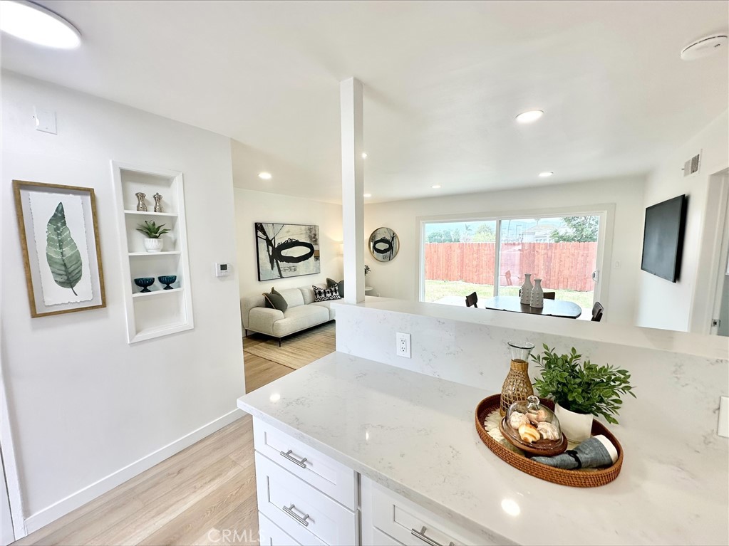 1608 Alviso Street Simi Valley, CA 93065 - Photo 9 of 13 a living room with furniture and a wooden floor