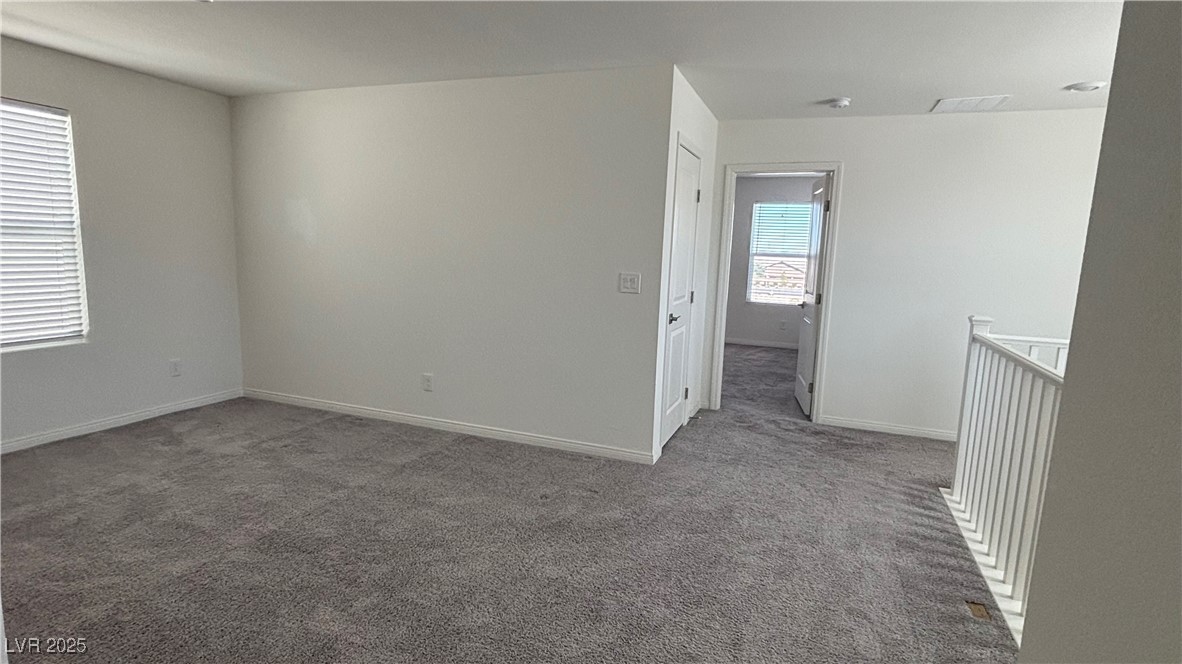 8736 Victoria Pk Street Las Vegas, NV 89148 - Photo 18 of 35 Unfurnished room with carpet and baseboards