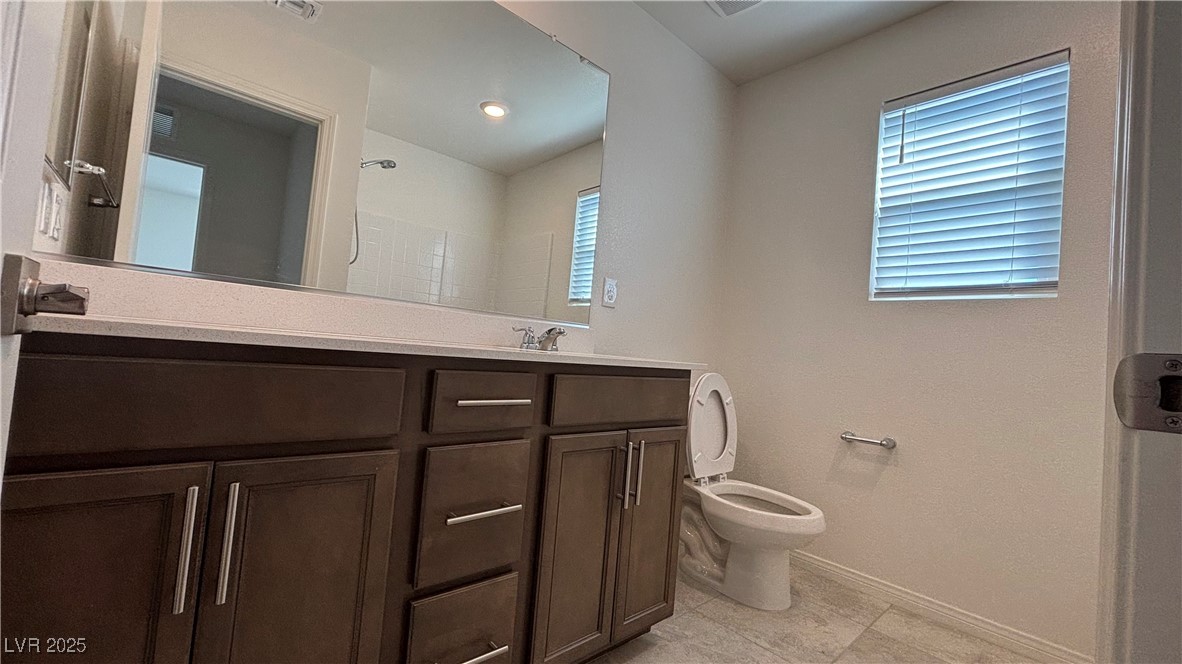 8736 Victoria Pk Street Las Vegas, NV 89148 - Photo 21 of 35 Full bathroom featuring double vanity and light tile patterned floors