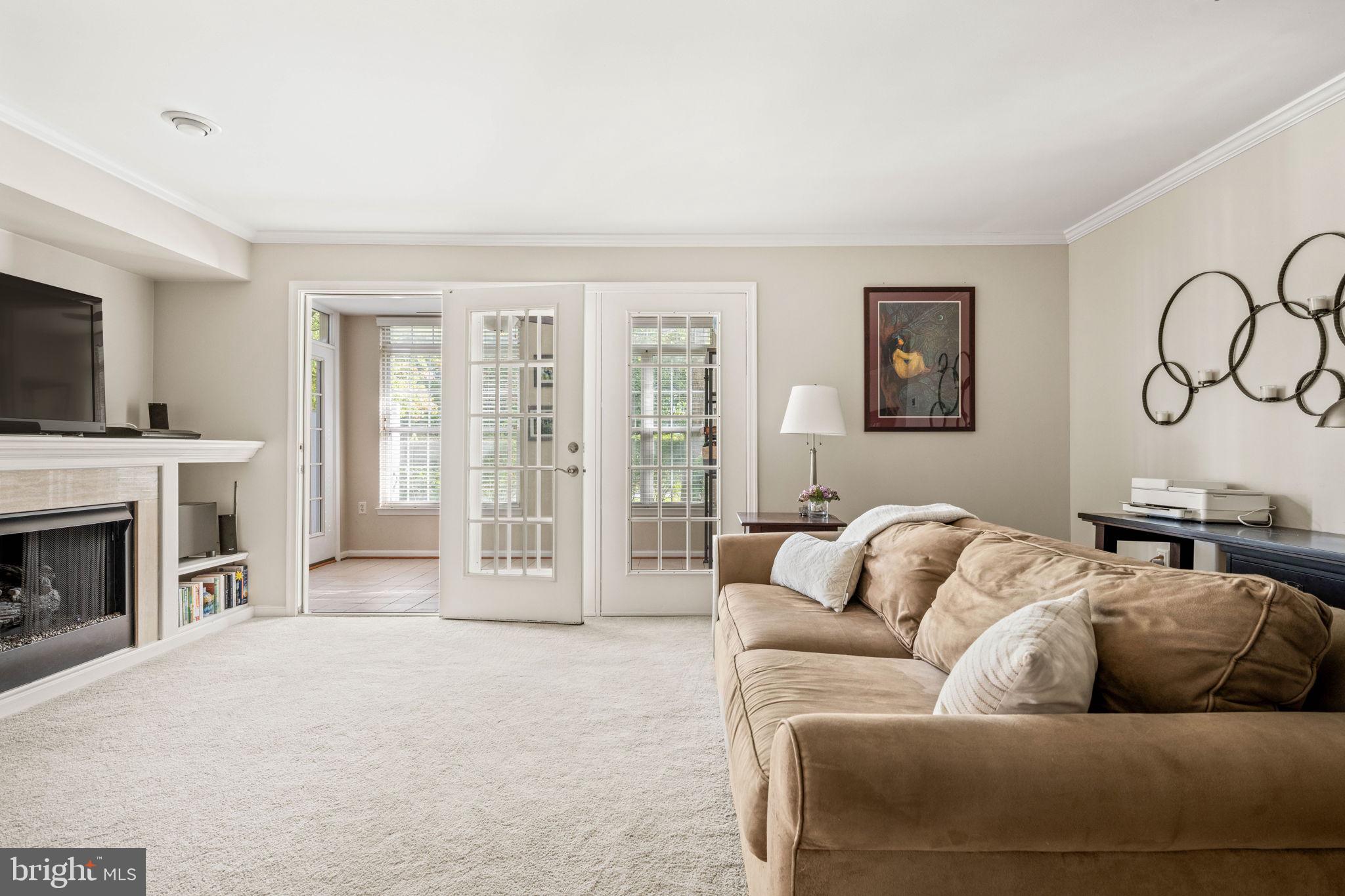 6602 Thackwell Way, Unit C Alexandria, VA 22315 - Photo 13 of 54 a living room with furniture and a fireplace