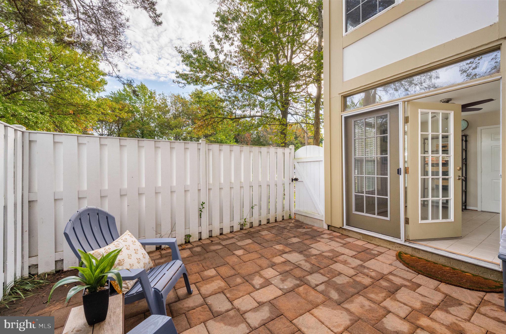 6602 Thackwell Way, Unit C Alexandria, VA 22315 - Photo 22 of 54 a view of balcony with two chairs and a table