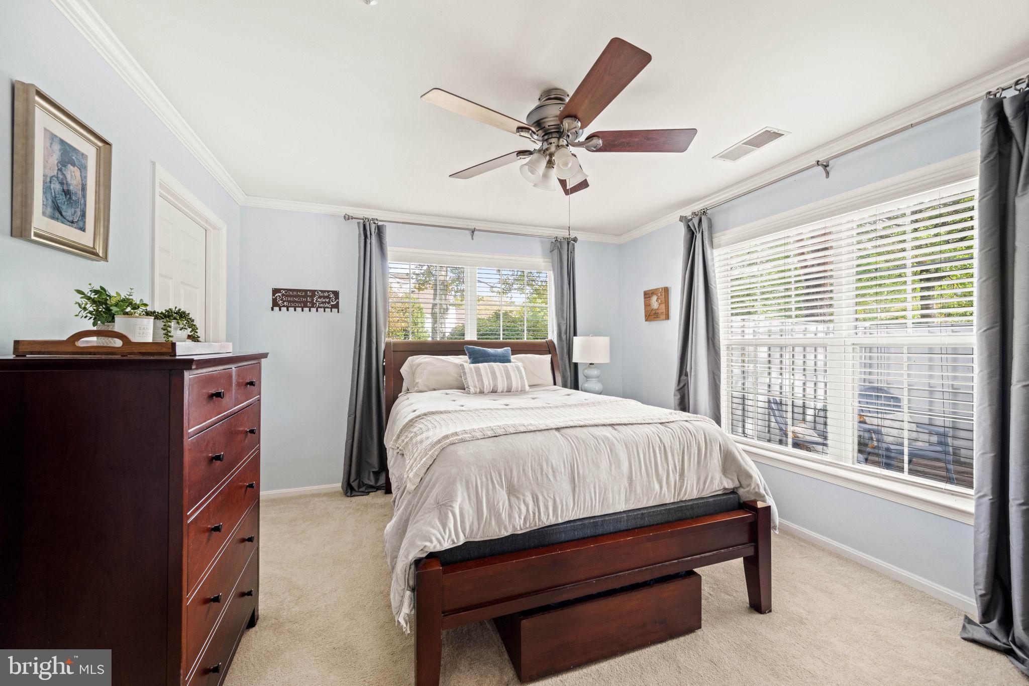 6602 Thackwell Way, Unit C Alexandria, VA 22315 - Photo 24 of 54 a bedroom with a bed and a chandelier