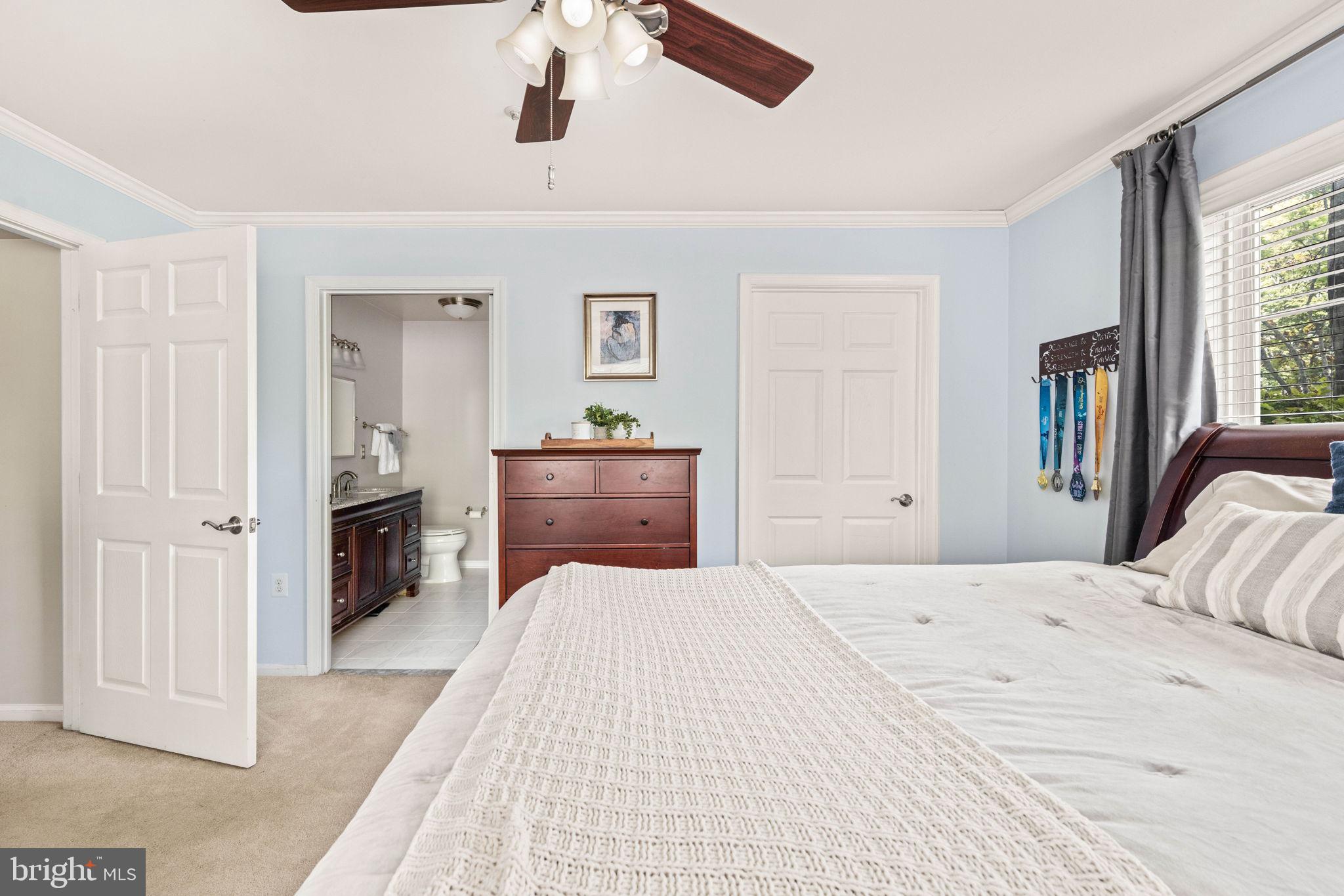 6602 Thackwell Way, Unit C Alexandria, VA 22315 - Photo 26 of 54 a bedroom with a large bed and a dresser