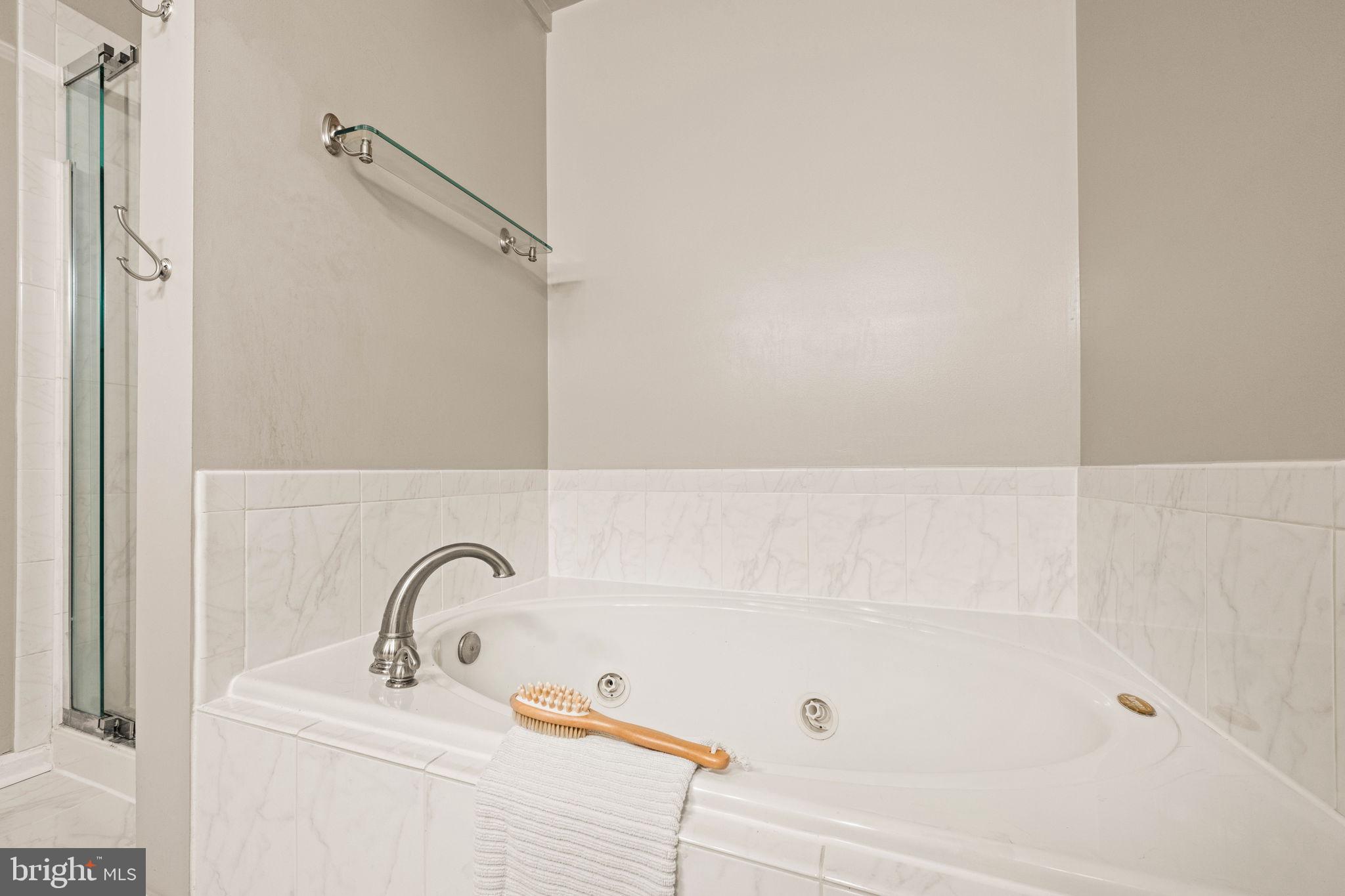 6602 Thackwell Way, Unit C Alexandria, VA 22315 - Photo 28 of 54 a bathroom with a sink and shower