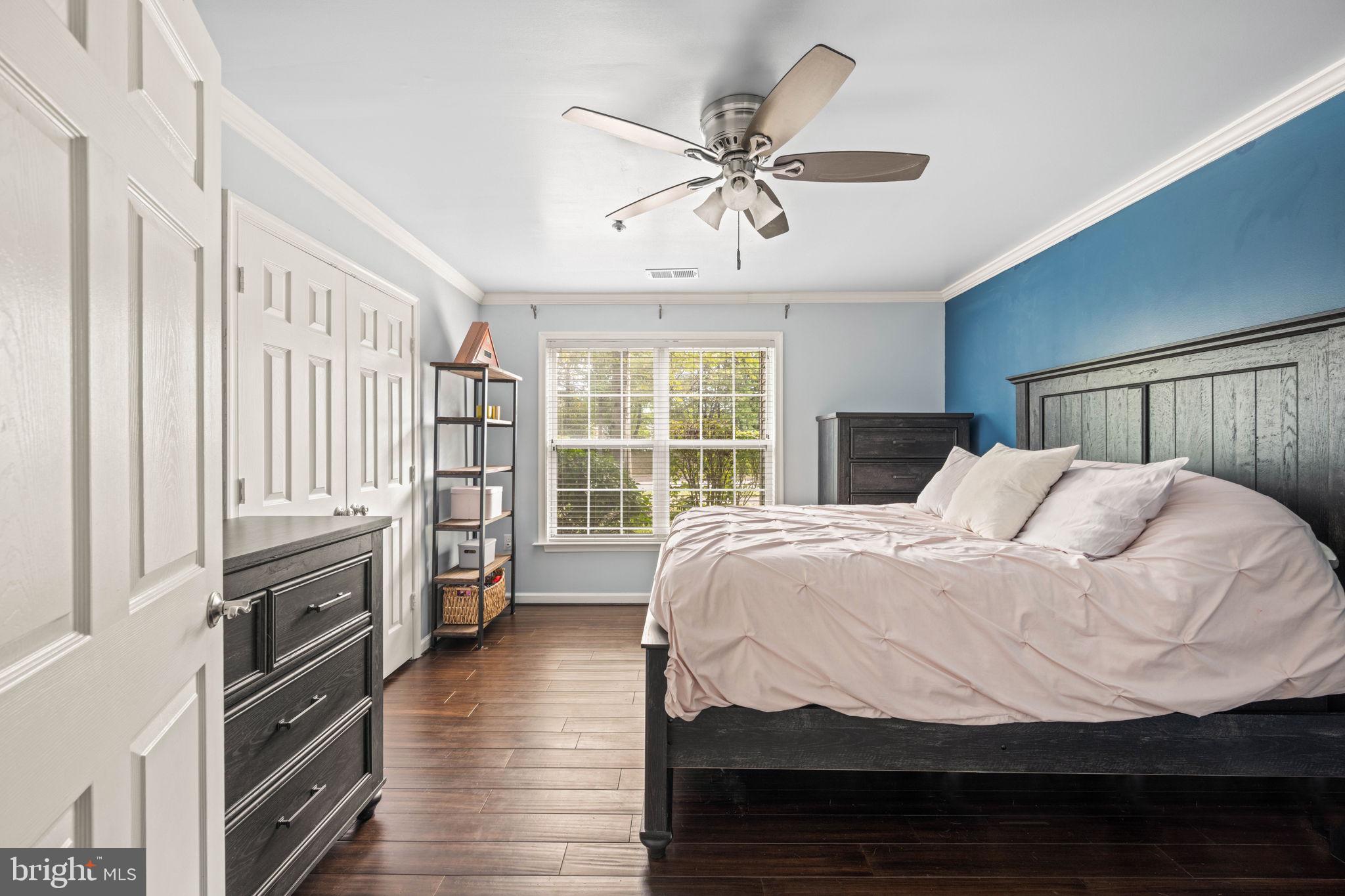 6602 Thackwell Way, Unit C Alexandria, VA 22315 - Photo 30 of 54 a bedroom with a bed and a flat screen tv