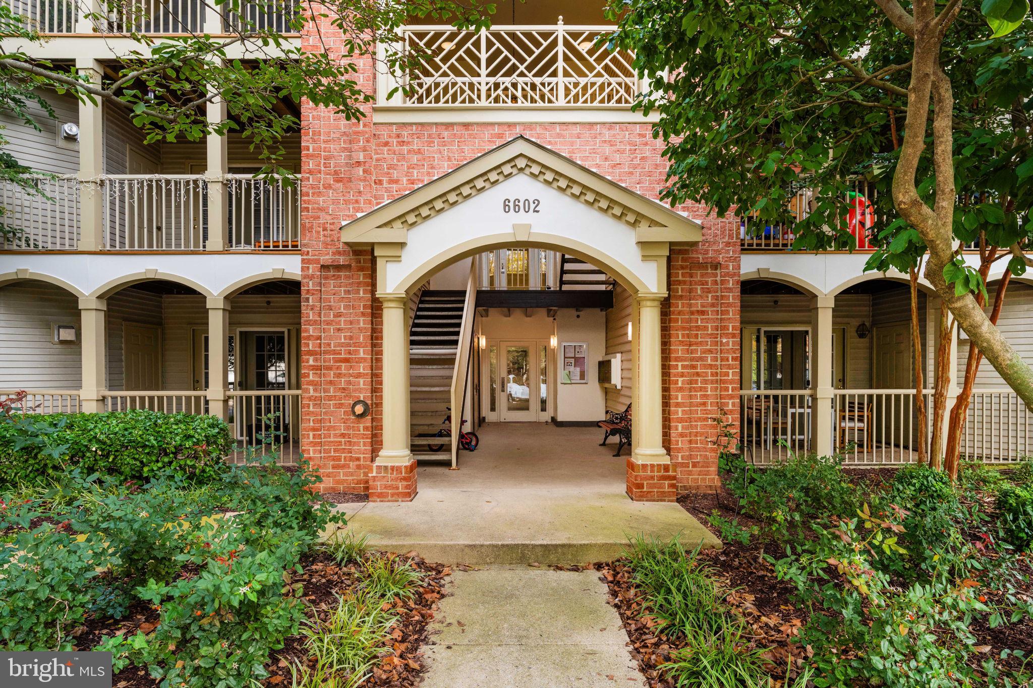 6602 Thackwell Way, Unit C Alexandria, VA 22315 - Photo 3 of 54 a front view of a house with garden
