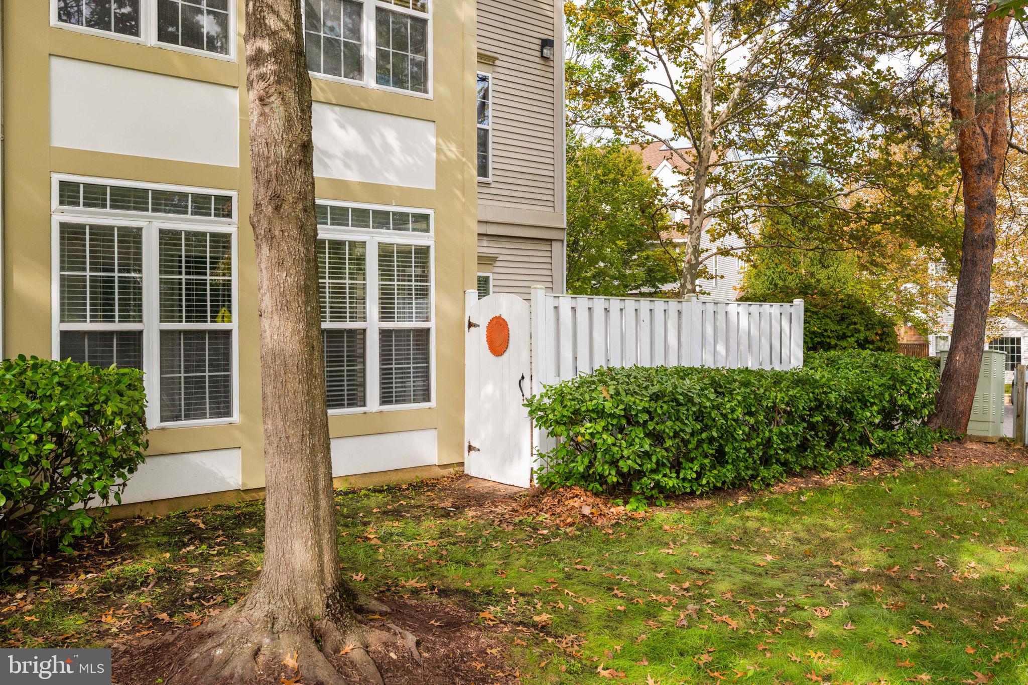 6602 Thackwell Way, Unit C Alexandria, VA 22315 - Photo 39 of 54 a front view of a house with garden