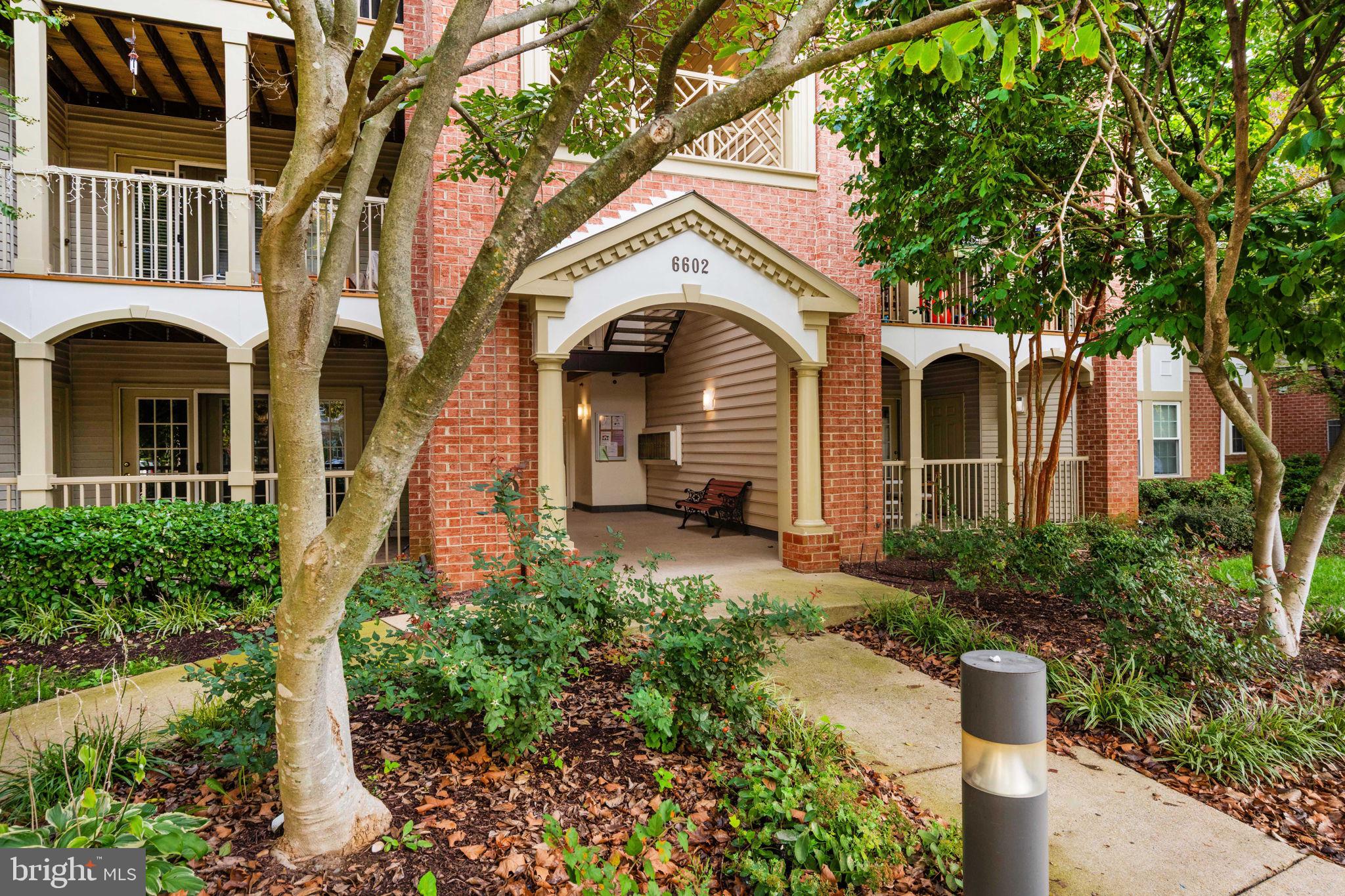 6602 Thackwell Way, Unit C Alexandria, VA 22315 - Photo 42 of 54 a front view of a house with a garden